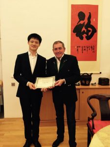 Certificate presentation on behalf of OCFMK by Dr. Schaden, Stadt Salzburg Bürgermeister